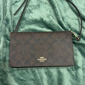 Monogram Coach crossbody clutch.like new